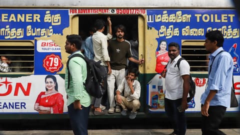 Passengers wait at Egmore station after suburban services were disrupted due to a signal failure