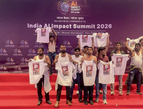Indian Youth Congress workers stage a protest during the India AI Impact Summit 2026 at Bharat Mandapam, in New Delhi. 