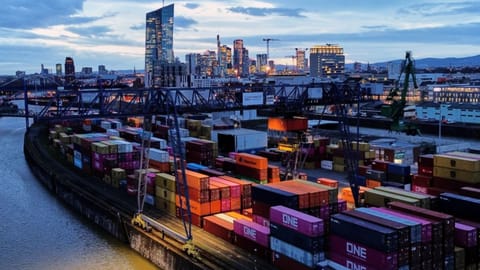 Containers are stored in a cargo terminal in Frankfurt, Germany, Monday, Feb. 23, 2026