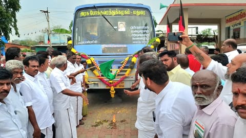Villagers  in Varusanadu welcome the bus by breaking coconuts and showering flowers 