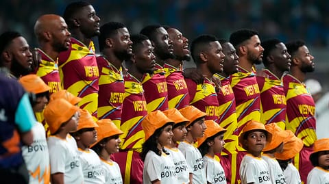 West Indies' players stand up for the national anthems before the start of the T20 World Cup cricket match between India and West Indies in Kolkata, India, Sunday, March 1, 2026 