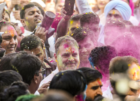 Rahul celebrates Holi with Congress workers at party office
