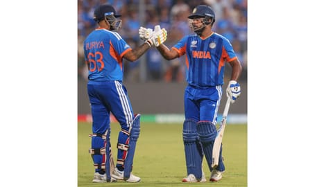 India's Sanju Samson, right, greets captain Suryakumar Yadav as he returns to the pavilion after the former's dismissal by England's Will Jacks during the ICC Men's T20 World Cup 2026 second semifinal cricket match between India and England, at the Wankhede Stadium, in Mumbai, Maharashtra, Thursday, March 5, 2026 