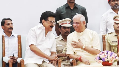 Chief Minister MK Stalin, Governor-in-charge Rajendra Vishwanath Arlekar sharing a lighter moment at the swearing-in ceremony at Lok Bhavan on Thursday