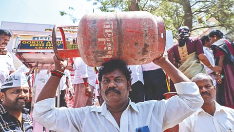 Members of DMK-led SPA protested with empty LPG cylinders, and also demanded the Centre to release pending funds