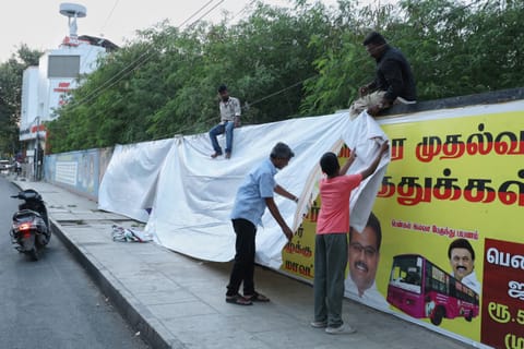 Election Department's drive to cover political banners as part of the Model Code of Conduct enforcement in Chennai on Monday