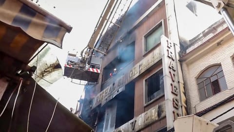 Rescue operations underway after a fire broke out in a residential building near Palam Metro station, in New Delhi, Wednesday, March 18, 2026 
