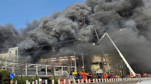 Black smoke rises from an auto parts plant in Daejeon, South Korea