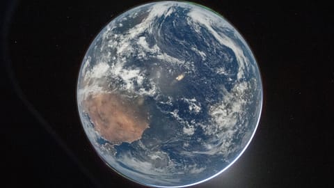A view of Earth taken by NASA astronaut and Artemis II Commander Reid Wiseman from of the Orion spacecraft's window after completing the translunar injection burn 