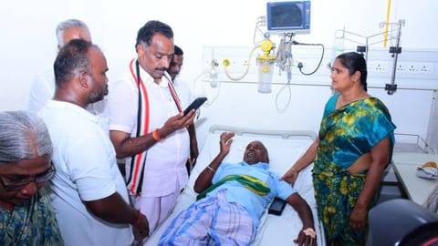 AIADMK former minister MR Vijayabaskar visiting injured cadre at a private hospital in Karur on Friday