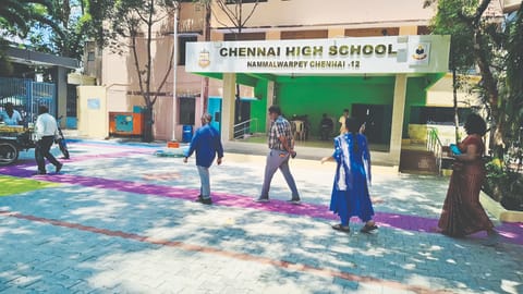 Pathways marked in blue and pink at the polling station in Chennai High School in Nammalwarpet