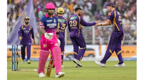 Kolkata Knight Riders' Varun Chakravarthy, 29, with Cameron Green, right, celebrates after taking the wicket of Rajasthan Royals' captain Riyan Parag during the Indian Premier League (IPL) 2026 T20 cricket match between Kolkata Knight Riders and Rajasthan Royals, at Eden Gardens in Kolkata, West Bengal, Sunday, April 19, 2026 