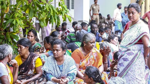Family members and relatives gather outside a government hospital following the deaths of victims of a firecracker factory explosion, in Virudhunagar
