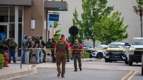Law enforcement personnel respond to reports of a shooting at Mall of Louisiana in Baton Rouge, La