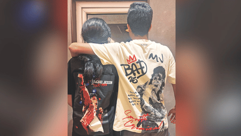 Fans dressed in Michael merchandise in theatres