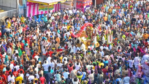 Scores of devotees gather as Lord Kallazhagar arrives in the temple town of Madurai on Thursday 