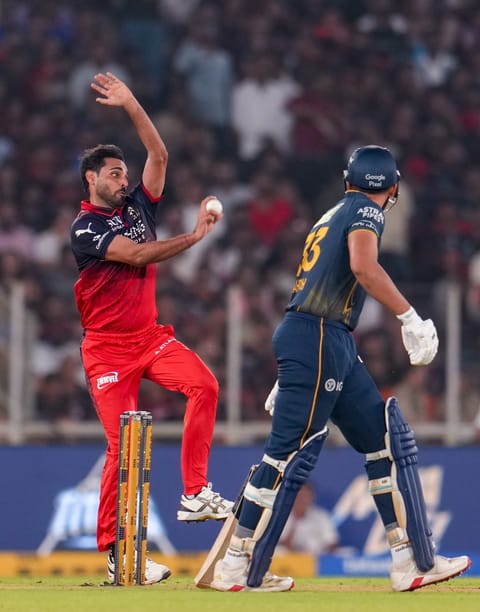 Royal Challengers Bengaluru's Bhuvneshwar Kumar bowls a delivery during the Indian Premier League (IPL) 2026 T20 cricket match between Gujarat Titans and Royal Challengers Bengaluru, in Ahmedabad, Gujarat, Thursday, April 30, 2026 