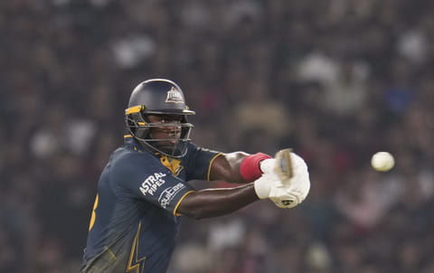 : Gujarat Titans' Jason Holder plays a shot during the Indian Premier League (IPL) 2026 T20 cricket match between Gujarat Titans and Royal Challengers Bengaluru, in Ahmedabad, Gujarat, Thursday, April 30, 2026.
