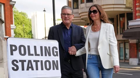 Britain's Prime Minister Keir Starmer and wife Victoria arrive at a polling station in central London