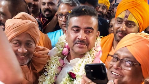 Newly-sworn West Bengal Chief Minister Suvendu Adhikari being welcomed upon his arrival at Bharat Sevashram Sangha, in Kolkata, Saturday, May 9, 2026