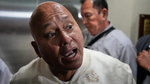Philippine Senator Ronald dela Rosa speaks to reporters at the Philippine Senate in Pasay