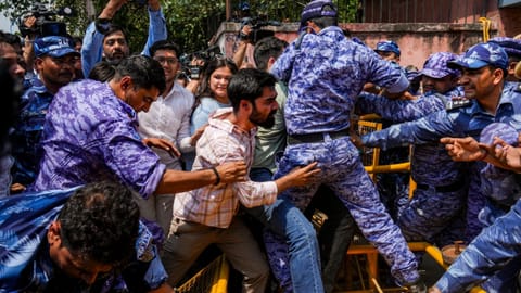 A scuffle between the RAF personnel and Akhil Bharatiya Vidyarthi Parishad (ABVP) members after they stage a protest against the National Testing Agency (NTA) over alleged paper leak concerns following the cancellation of the NEET-UG 2026 examination, at NTA office, in New Delhi