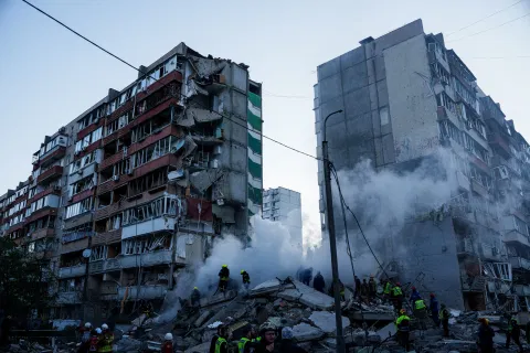 Rescue workers clear the rubble of a house heavily damaged after a Russian strike on a residential neighborhood in Kyiv, Ukraine, on Thursday, May 14, 2026