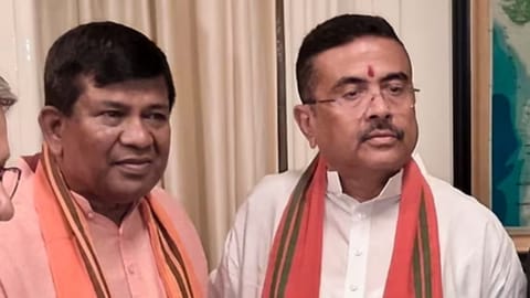 BJP first-time MLA from Cooch Behar Dakshin constituency Rathindra Bose (L) with West Bengal chief minister Suvendu Adhikari