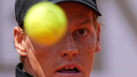Italy's Jannik Sinner eyes the ball as he plays Andrey Rublev.