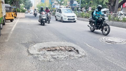 Neglected manhole cover with iron rods protruding on Sir Thyagaraya Road near Pondy Bazaar