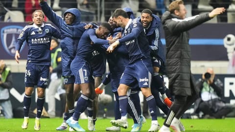 Paris FC's Alimami Gory, centre left, celebrates with teammates after scoring his side's second goal during the French League One soccer match between Paris FC and Paris Saint-Germain in Paris