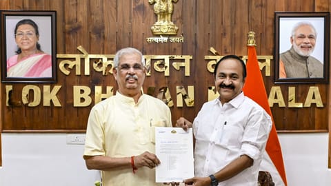 Kerala Governor Rajendra Vishwanath Arlekar receives the list of cabinet ministers from the Chief Minister-designate V D Satheesan ahead of the swearing-in ceremony, at the Lok Bhavan, in Thiruvananthapuram