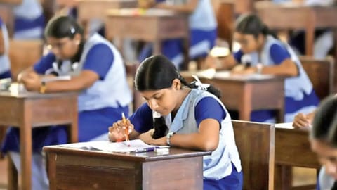 Image of students writing exam used for representative purpose