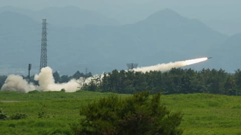 US Marines conduct a live-fire training of the High Mobility Artillery Rocket System, short for HIMARS, at Camp Fuji, in Gotemba, southwest of Tokyo