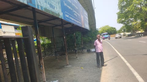 The bus stop beneath the Walajabad flyover