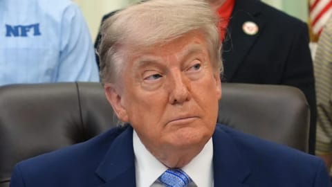 President Donald Trump attends an event about loosening a federal refrigerant rule, in the Oval Office at the White House