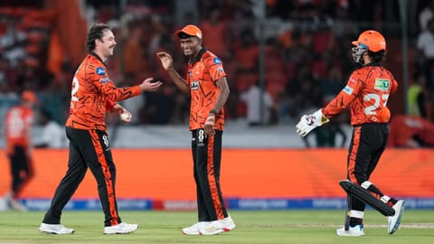 Sunrisers Hyderabad's Travis Head, left, celebrates with teammate Sakib Hussain after taking the wicket of Royal Challengers Bengaluru's captain Rajat Patidar during the Indian Premier League (IPL) 2026 T20 cricket match between Sunrisers Hyderabad and Royal Challengers Bengaluru, in Hyderabad, Telangana