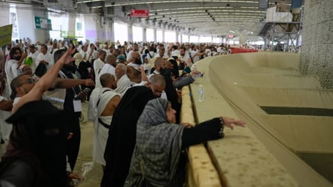 Muslim pilgrims pray after they cast pebbles at pillars in the symbolic stoning of the devil, the last rite of the annual Hajj, in Mina near the holy city of Mecca, Saudi Arabia, Wednesday, May 27, 2026.