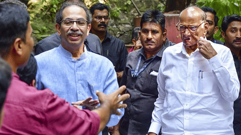 Uddhav Thackeray (left) with Sharad Pawar.