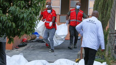 Red Cross members recover the bodies of students who died in the re at the Utumishi Girls School in the Gilgil area, central Kenya, Thursday, May 28, 2026.
