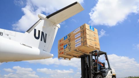 Workers load World Health Organization (WHO) emergency supplies onto a United Nations plane in Nairobi, Kenya