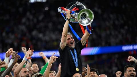 Luis Enrique lifts the Champions League for a third time