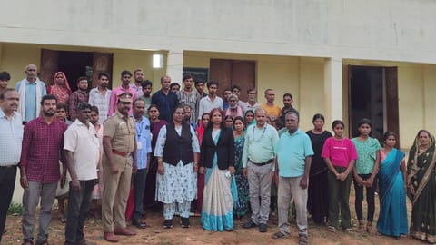 Rescued workers standing with the officials in Tiruvallur