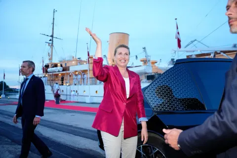 Acting Prime Minister Mette Frederiksen, center, waves on the royal ship Dannebrog on Monday, June 1, 2026, as the royal ship Dannebrog is docked at Odense Harbor.