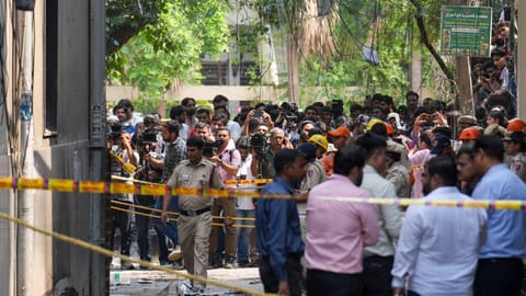 Police cordon off the area after a fire broke out at a bed-and-breakfast in a five-storey building in south Delhi's Malviya Nagar area