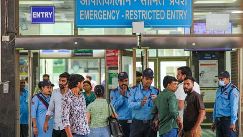 People waiting outside Max Hospital after a fire in Delhi's Malviya Nagar area leaves 21 people dead