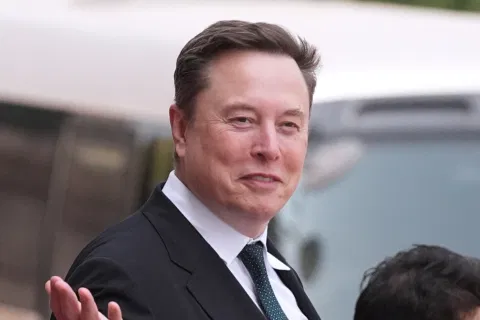 Elon Musk departs after a welcome ceremony with President Donald Trump and China’s President Xi Jinping at the Great Hall of the People, Thursday, May 14, 2026, in Beijing