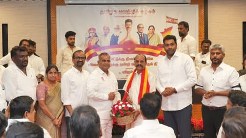 AIADMK former minister joining TVK in the presence of party general secretary N Anand in Chennai on Saturday