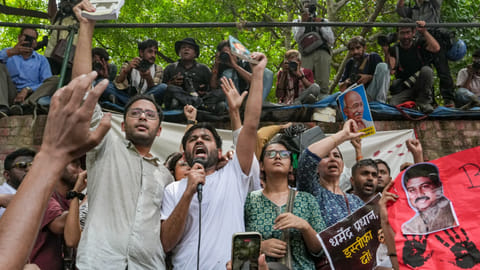New Delhi: Cockroach Janta Party's (CJP) founder Abhijeet Dipke, in white, spokesperson Ashutosh Ranka, left, and others raise slogans during a protest demanding the resignation of Union Education Minister Dharmendra Pradhan over alleged examination-related lapses, at the Jantar Mantar, in New Delhi, Saturday, June 6, 2026
