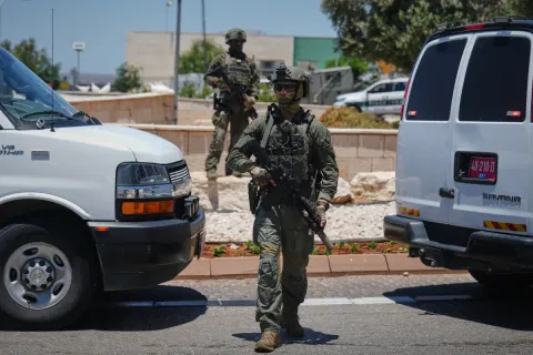 Israeli security forces are deployed at the scene of a shooting attack carried out by a Palestinian citizen of Israel near Tzur Yitzhak in central Israel, Sunday, June 7, 2026.